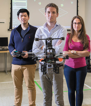 Professor and students test an autonomous drone.
